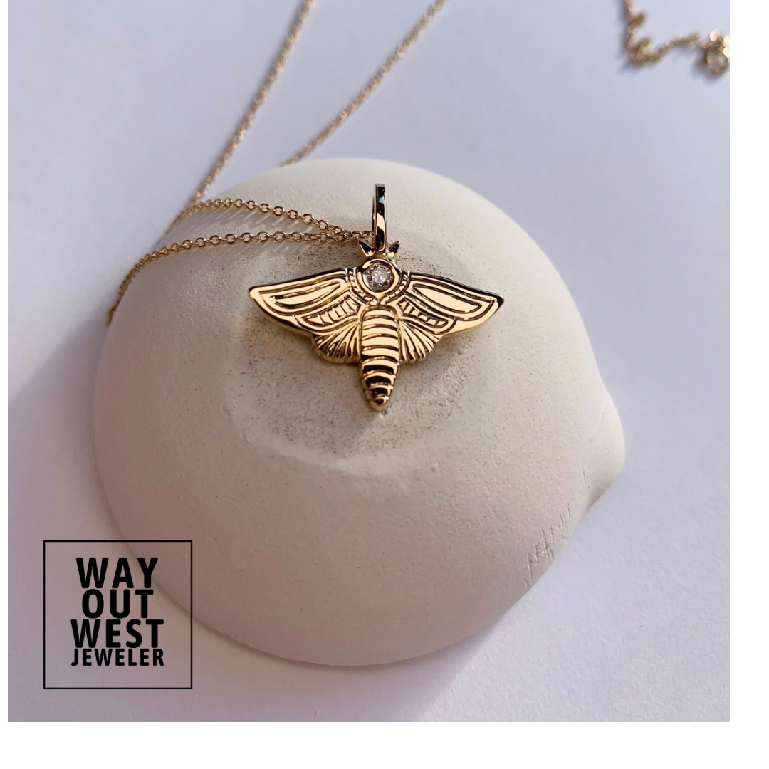 Diamond moth charm