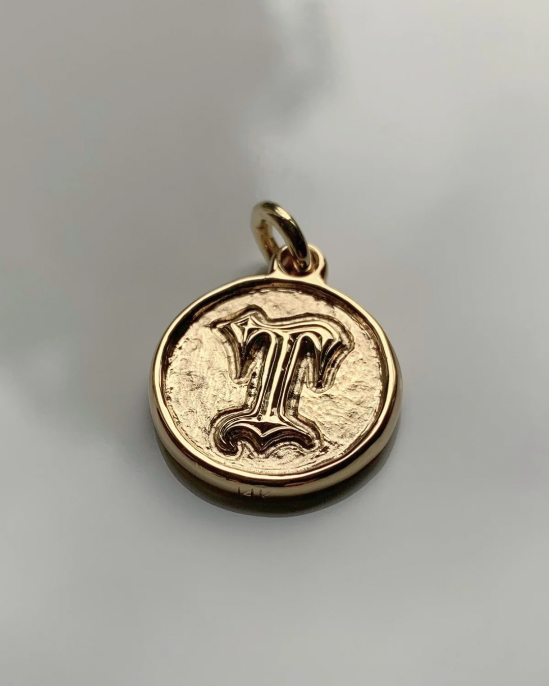 Custom embossed initial pendant