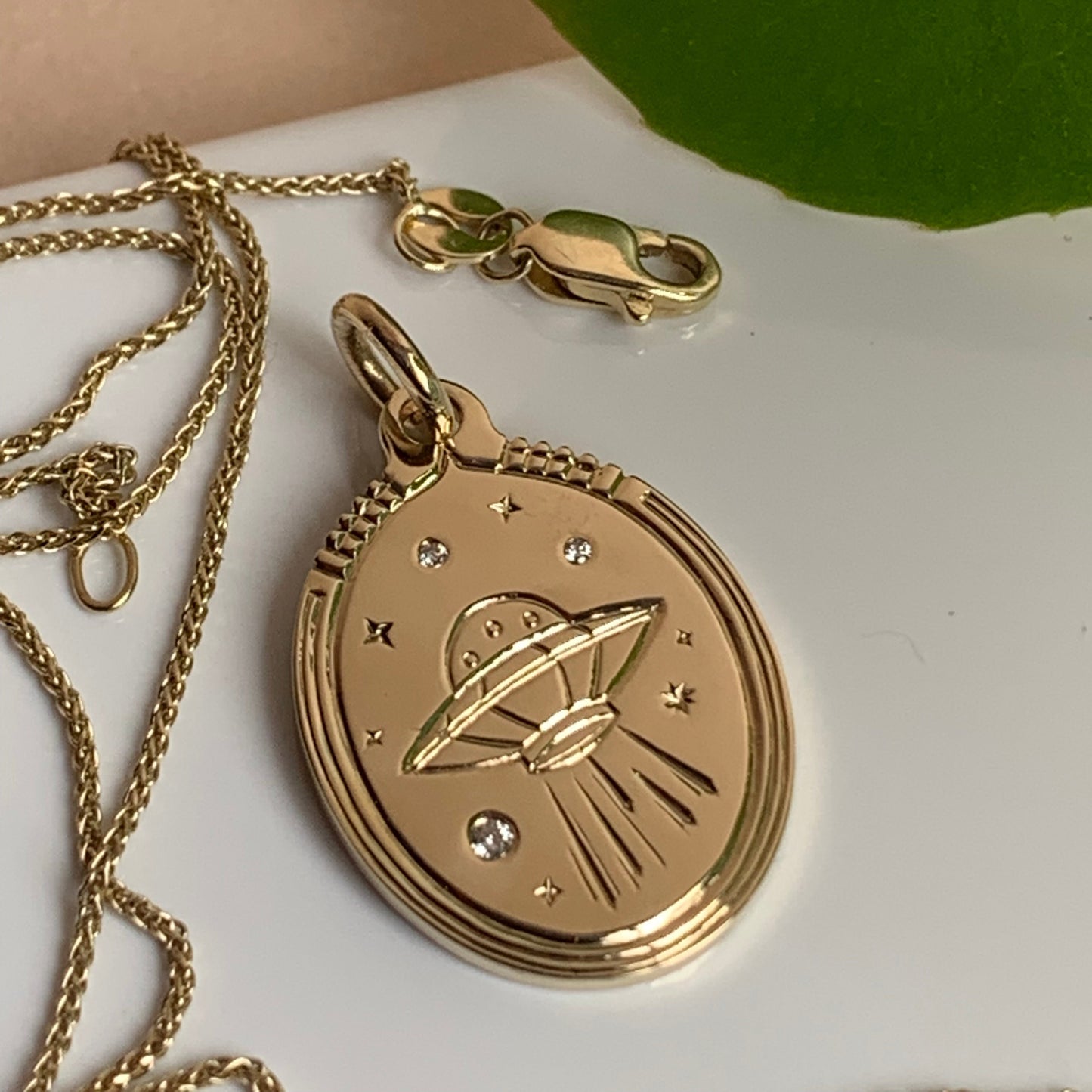 UFO charm with diamonds