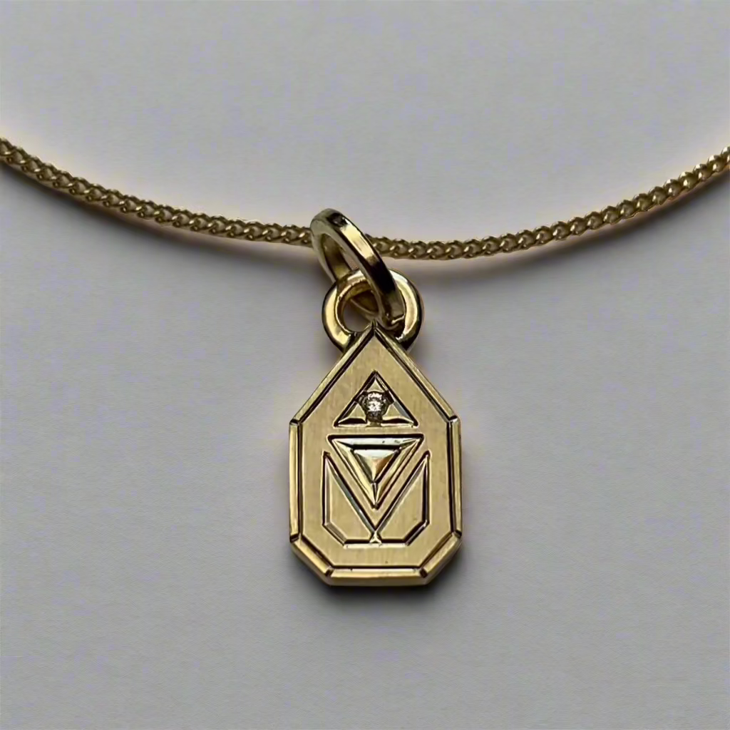 geo diamond charm on necklace