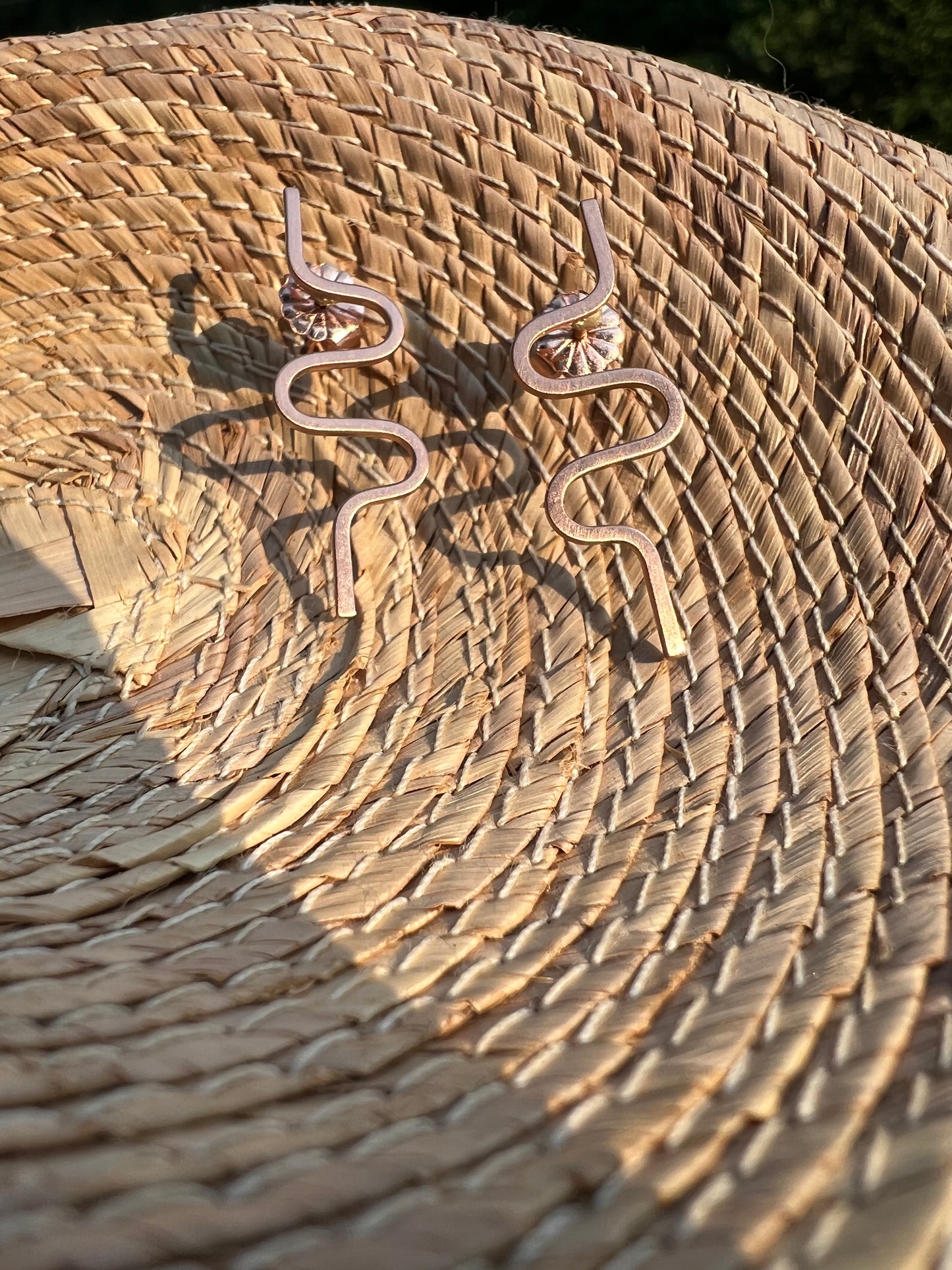 Squiggle earrings made with recycled 14k gold.