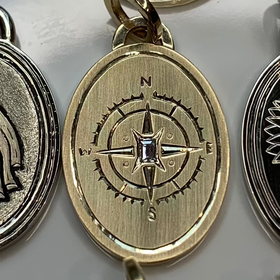 compass charm in gold