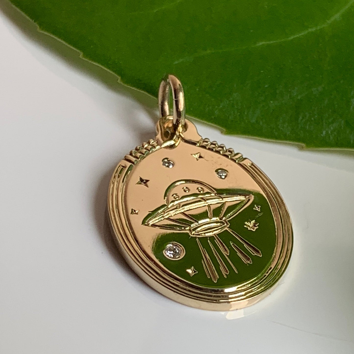 side view of ufo charm